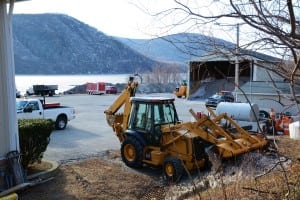 The salt shed, mounds of snow, and equipment at the Cold Spring Village Garage site.