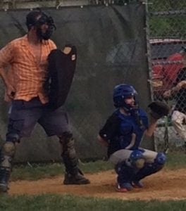 Thomas Tucker settles in behind the plate during the Little League minors Giants' 8-2 victory over the Mets on Monday, May 11.