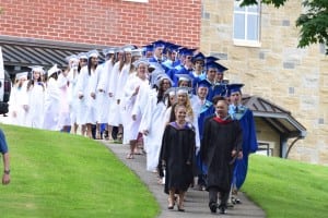 Ceremonies began with the graduates-elect making the walk down from the high school for the last time. Photo by M. Turton