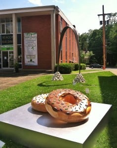 "In The Round" by Jon Reichert in the foreground, "Grounded Rainbow" by Lori Merhige in the background. 