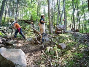 Jolly Rovers at work, "flying" a stone on a highline.