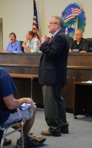 Mark Butler, the Town Board's consulting attorney, answers audience questions. 