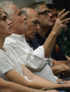 Joe Regele (second from left) emphasizes a point of opposition to the proposed Garrison Fire District.