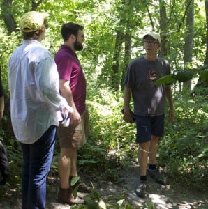 Joe Dizney, right, leads a mushroom walk at Denning's Point in Beacon Aug. 8.