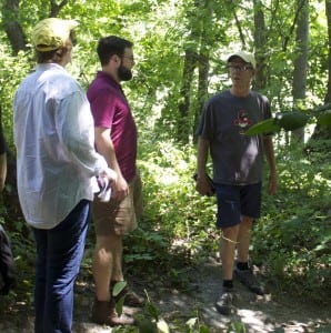 Joe Dizney, right, leads a mushroom walk at Denning's Point in Beacon Aug. 8.