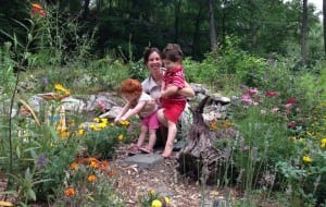 Krystal Ford with her son, Edison, and daughter, Lilly, in their butterfly garden