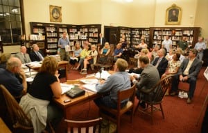 Philipstown Planning Board members and their advisors, at the table, listen to public comments on the proposed expansion of the Garrison Cafe.