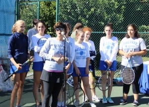 Rosemarie Sterling speaks at Community Day, joined by members of the Haldane varsity tennis team: Alii Sharpley, Olivia Sterling, Ashley Haines, Lucinda Strol, Molly Altucher, Olivia Olsen and Hali Traina. (Photo by A. Rooney)
