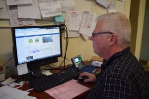 Director of Facilities Mike Twardy monitors electrical output from Haldane's solar project. (Photo by M. Turton) 