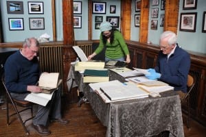 When the large room at the Howland Center isn't hosting events and classes, researchers can move out of the tight quarters of the Beacon Historical Society.  Here, research is being done on Craig House. (Photo by A. Rooney)  