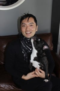Textile designer Suguru Miyagi, wearing one of his own creations, accessorized by his color-coordinated French bulldog. (Photo by A. Rooney)