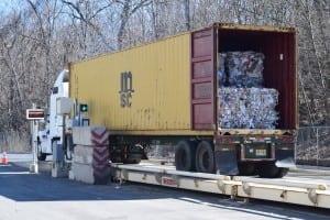 Bales are loaded into a truck to be delivered to manufacturing customers (photo by M. Turton)