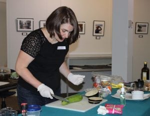 Cooking instructor Rebecca Weber demonstrates how best to slice a zucchini for a particular dish.  (Photo by A. Rooney)