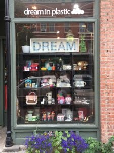 The storefront window at Dream in Plastic offers a sneak peak of what's inside. (Photo by A. Rooney)