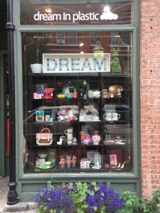 The storefront window at Dream in Plastic offers a sneak peak of what's inside. (Photo by A. Rooney)