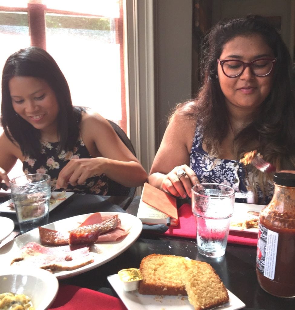 Two tour guests enjoy their tastings at a Rhinebeck restaurant. (Photo by Jennifer Brizzi)