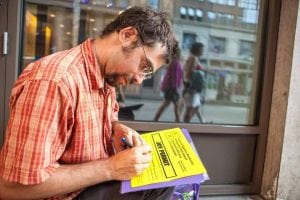Filling out Joy Permits during the Democratic National convention. (Photo by Amile Clark Wilson)