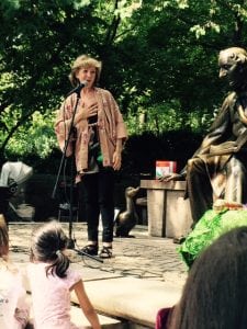 Judith Heineman performing at the statue of the Hans Christian Andersen in Central Park (photo provided) 