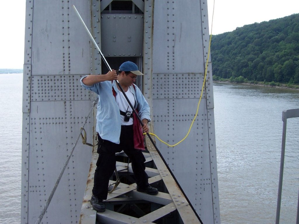 Joseph Bertolozzi bowing a cross frame of the Mid-Hudson Bridge (Photo provided)