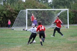 Jake Powers dribbling toward the goal on Oct. 2 for the Philipstown Soccer Club's U11 Strikers. (Photo by Patrice Delabie)