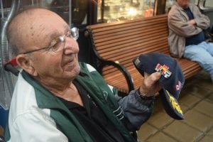 Joe Etta explains the service ribbons he earned in World War II. (Photo by M. Turton)