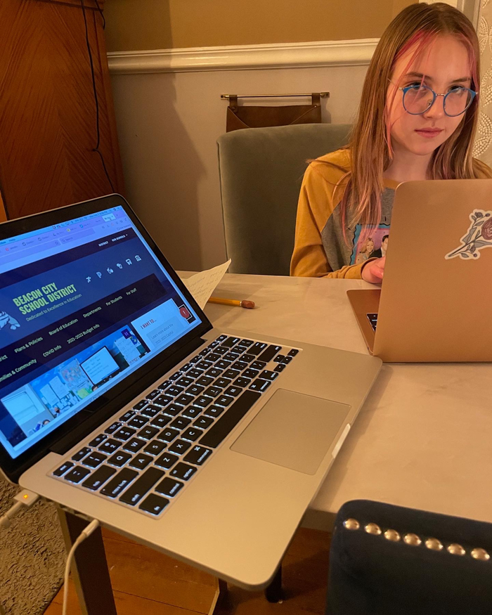 Ruby Martin, 11, gets ready to make her points during a virtual school board meeting.