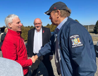 Former Gov. George Pataki, who lives in Garrison, visited Ukraine last week. Here he speaks with aid workers at the Hungarian border.