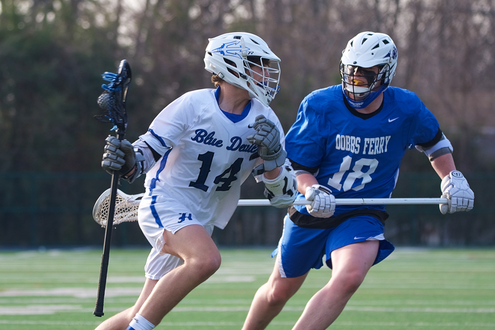 Rhys Robbins rolls around the crease looking for an opening against Dobbs Ferry.