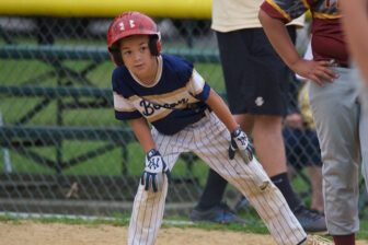 Easton White checks out the situation from first base during the Tuesday game.