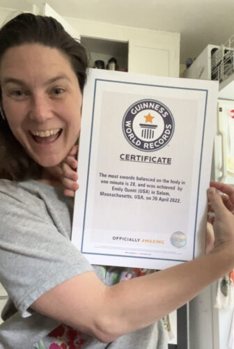 Quant shows off the Guinness certification for her 60-second record.