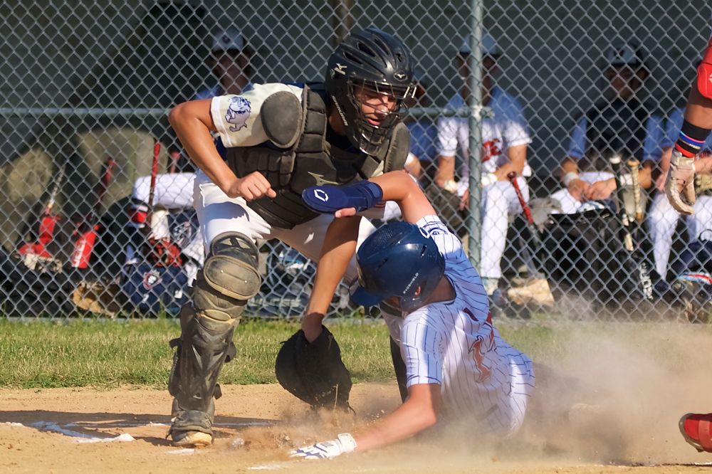 Catcher Mikey Fontaine puts the tag on a runner at home in Wednesday's 10-9 victory.