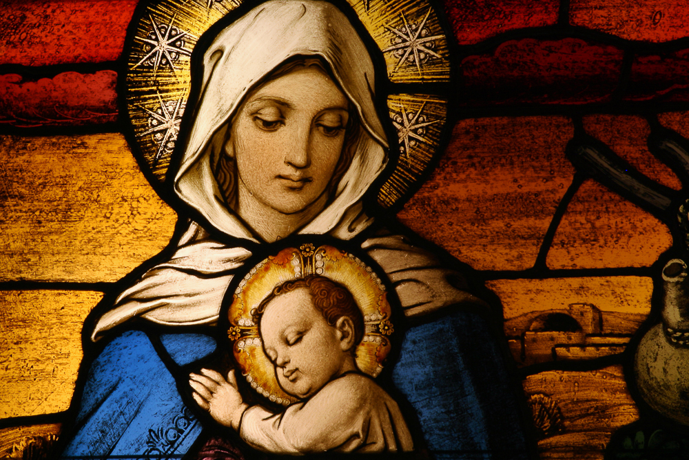 Stained glass depicting the Virgin Mary holding baby Jesus