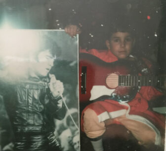 Jeff Barone at age 7 with Elvis, and his first guitar 