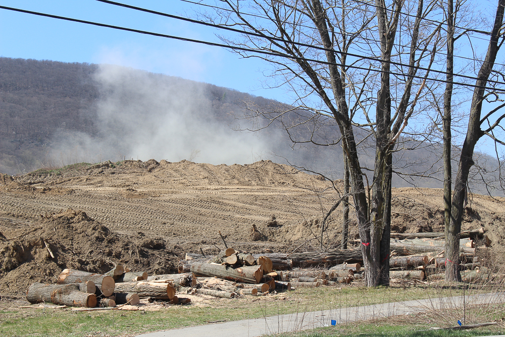 Dust rises from the property of Century Aggregates, which is building a new entrance on Route 9 for its mining operation. Photo by L. Sparks