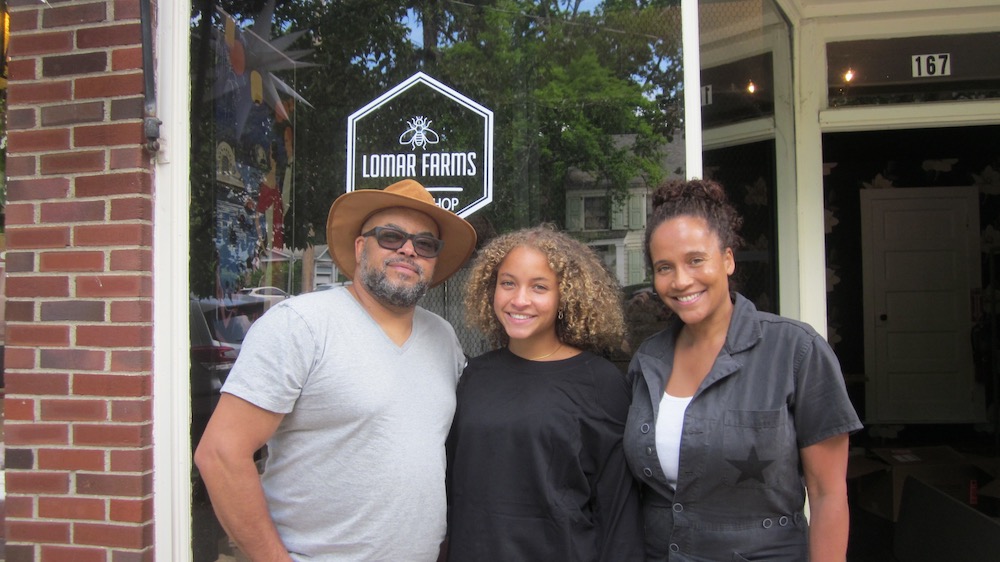 Brett Wright and Yvonna Kopacz with their daughter, Marley (center), outside their pop-up in Cold Spring Photo by M. Ferris