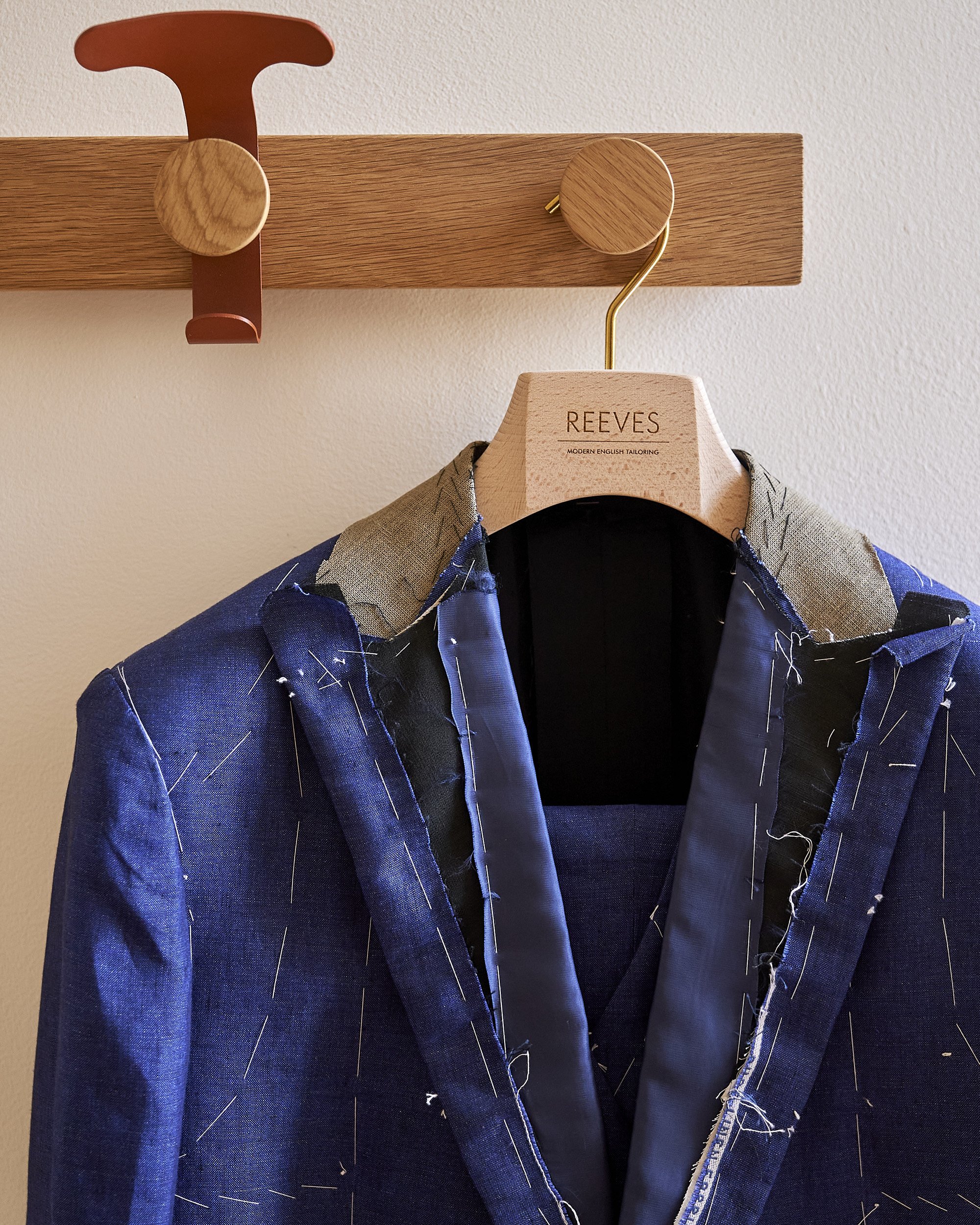 Basted-suit-on-hanger