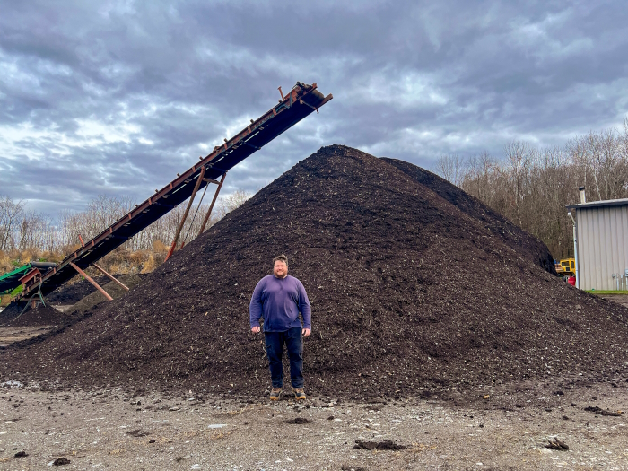 Matthew Hamm of McEnroe Organic Farm stands in front of a compost pile which he estimated was “a little shy of 1,000 [cubic] yards.”