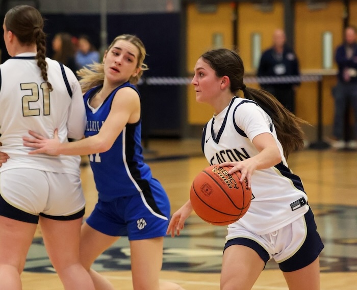 Reilly Landisi looks for an opening after coming off a screen by Devyn Kelly in the game against Wallkill.