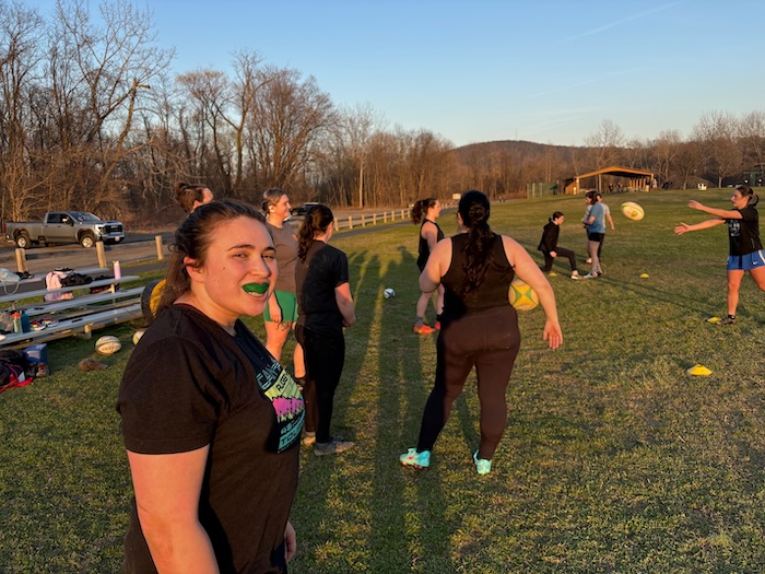 Grace "Wildcard" Mei, the women's club president, shows off her mouthguard. "On the field and in life, I am unpredictable," she said, to explain her nickname.