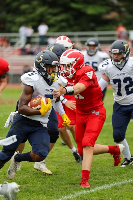 Elijah Epps looks for an opening during Beacon's 43-0 win. Photo by Cadence Heeter