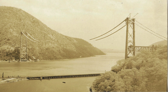 The cables are placed into their final position, May 2, 1924