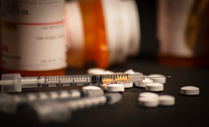 Loaded Syringe and Pills, drugs, opioids, needle