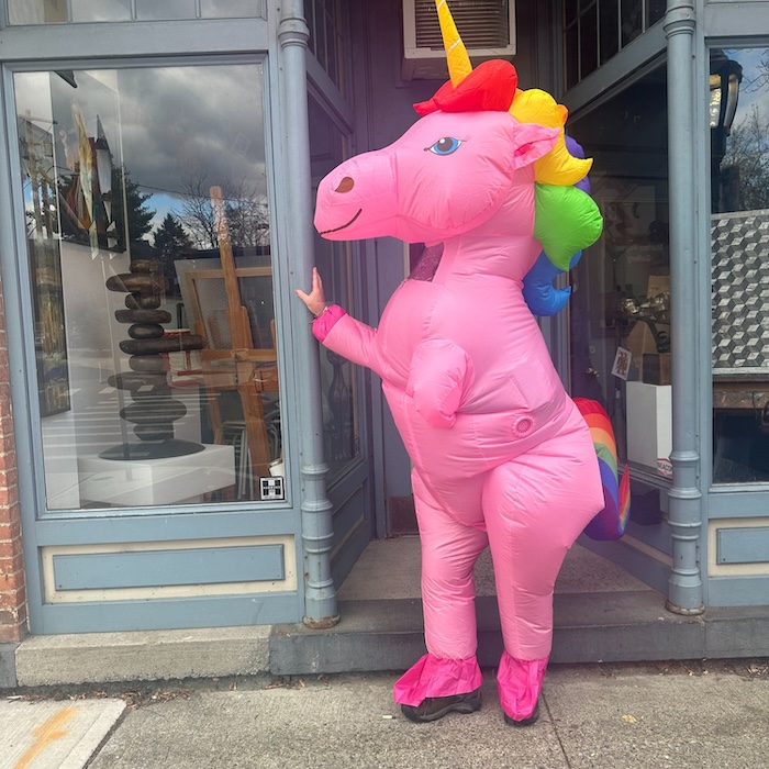 The unicorn stands ready to hug.