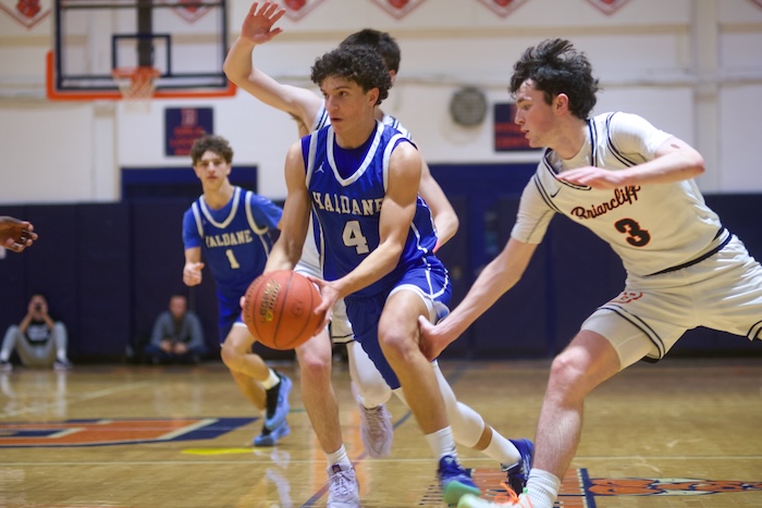 Zane Del Pozo drives past two Briarcliff defenders. Photo by Skip Pearlman