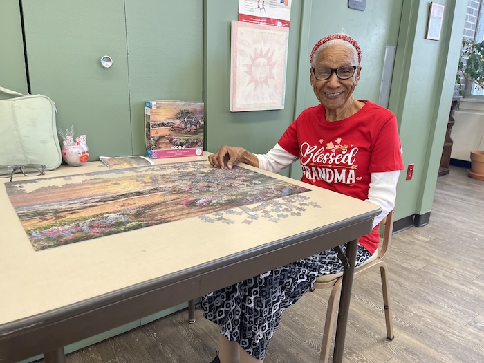 Felicita Pinto works on a puzzle at the Beacon Friendship Center. Photo by J. Asher