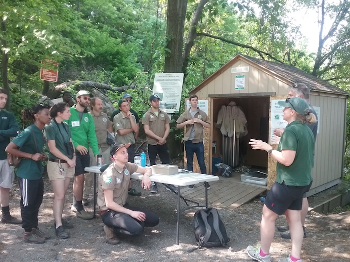 Trail stewards gather in 2018 at the Breakneck trailhead. A sign warns: "This is not just a walk in the park!" File photo