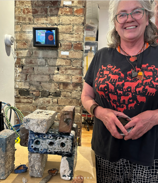 Lisa Knaus at the opening with her sculpture “Modern Ruins”