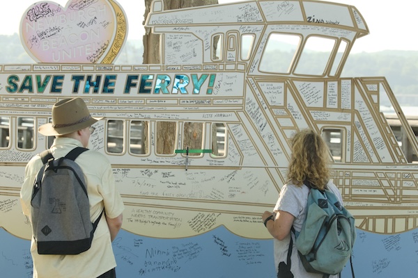 Supporters of the ferry signed a cutout during the rally in Beacon. Photo by Ross Corsair