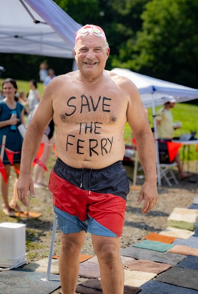 A participant in the River Pool's Hudson River swim on July 26 made his feelings known about the ferry.Photo by Alan Thomas 