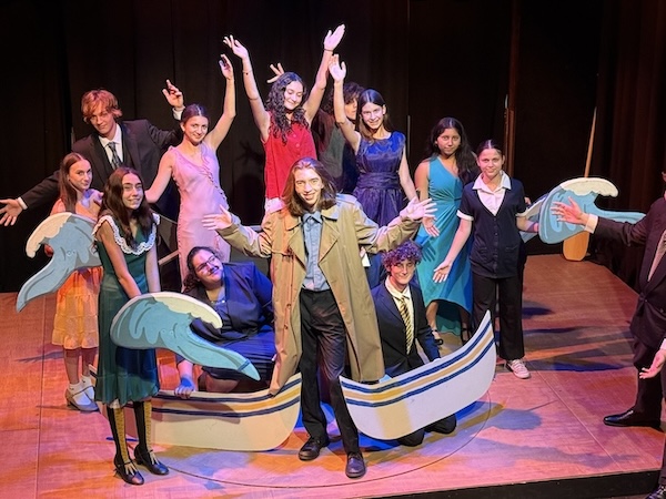 The cast of the Teen Players performance of "Curtains" poses on stage.